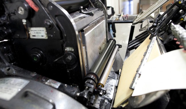 photo of Paper feeding through press