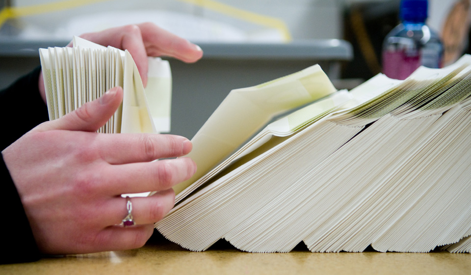 Stock papers envelopes main image No 2 image of hands flipping threw envelopes