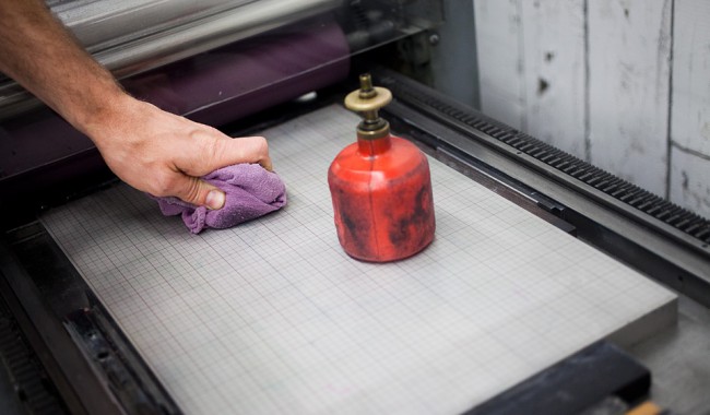 photo of cleaning vandercook base in bed