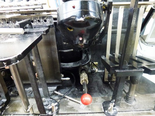 The impression bar on a letterpress machine