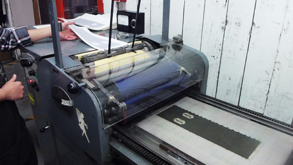 Our Vandercook press in action printing bellybands.